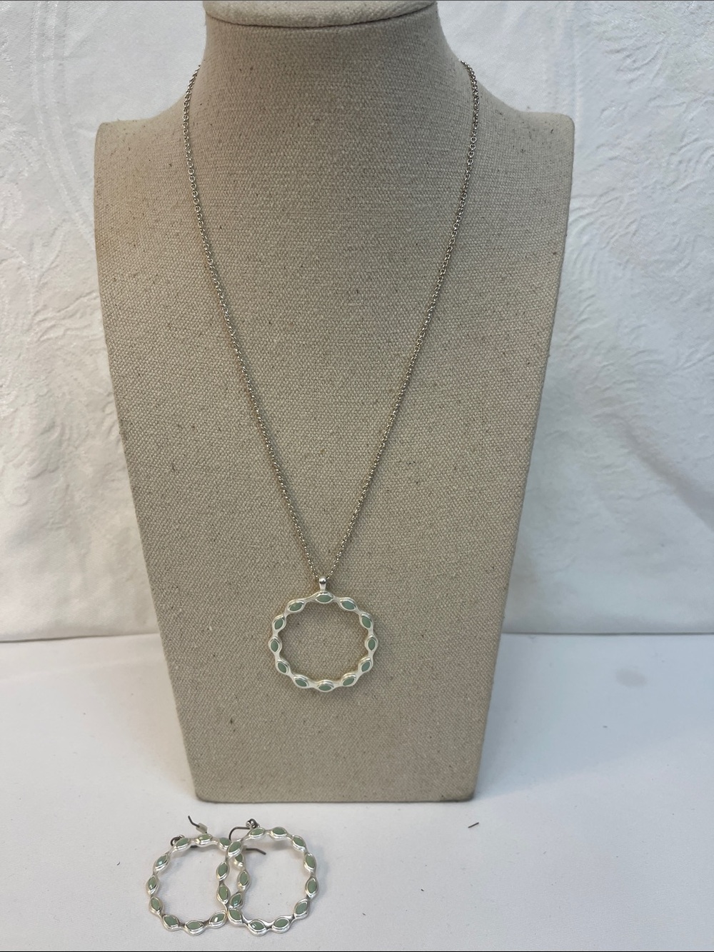 Three piece set necklace, matching earrings, light green, circular design